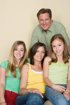 Portrait of happy three-generation family with two girls (8-9, 14-15)