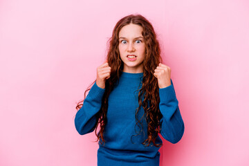 Little caucasian girl isolated on pink background upset screaming with tense hands.