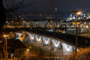 .view of the pillars on the modern cement railway bridge in the center of prague at night 2021