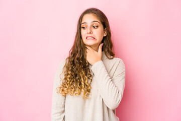 Fototapeta premium Young caucasian woman touching back of head, thinking and making a choice.