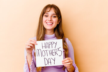 Fototapeta na wymiar Young caucasian woman holding a Happy mothers day placard isolated happy, smiling and cheerful.