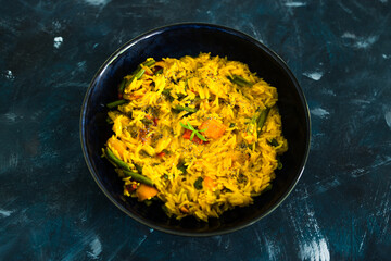 plant-based food, vegan turmeric risotto with pumpkin green beans and red pepper with dairy free sauce