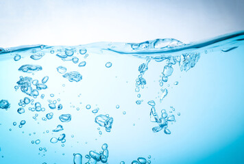 The flow of water creates a splash and the blue waves underwater, and the bubbles naturally flow to...