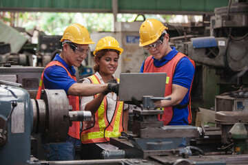 worker Industrial Engineers Talk with Factory Worker while Using Laptop. industrial worker is...