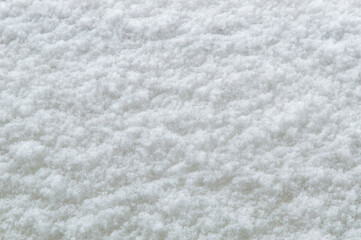 winter background: fresh clean even snow, large snowflakes