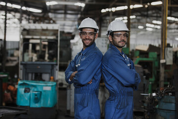 Portrait of an engineer at work in a factory. worker in factory on the machine
