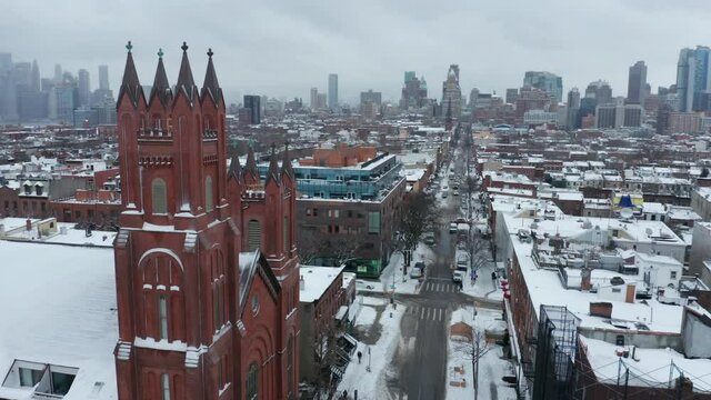 alt snowy winter day flying counter clock around church tower in Brooklyn