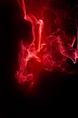 Red smoke motion on black background.