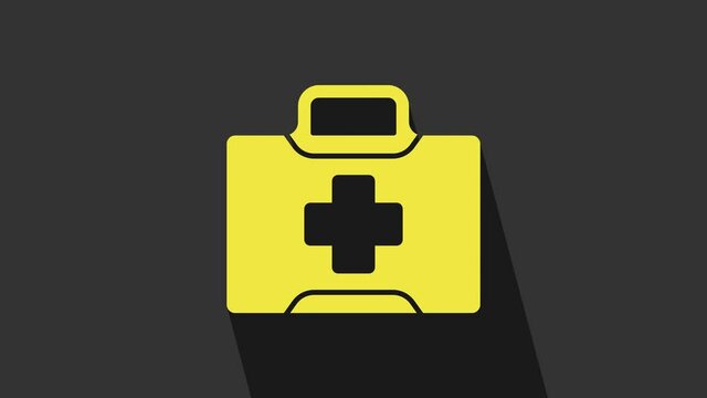 Yellow First aid kit icon isolated on grey background. Medical box with cross. Medical equipment for emergency. Healthcare concept. 4K Video motion graphic animation