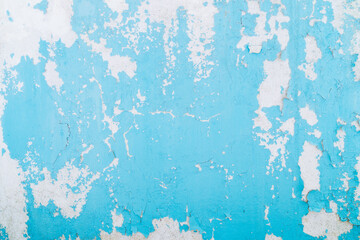 Blue paint background. Abstract blue peeling paint, mold and crack on the old concrete wall.