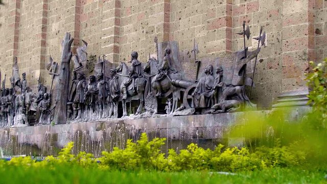 Monument of people and horses getting ready for the battle