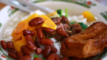 Rice and red kidney bean soup on plate. Indonesian food. 