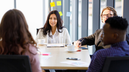 Woman caucasian leadership smilling and african american In meetings about plans business at the meeting room in the office. Concept woman leader..