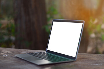 Laptop with blank screen on table