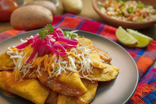 homemade stuffed meat pie on a background also called "pastelitos de perro" in honduras C