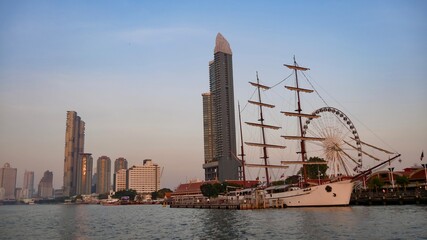 January 2 2021 - Bangkok, Thailand : Beautiful Landscape of high modern building and yacht at...
