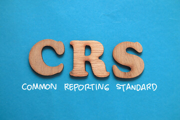 CRS Common Reporting Standard, text words typography written on blue background, life and business...