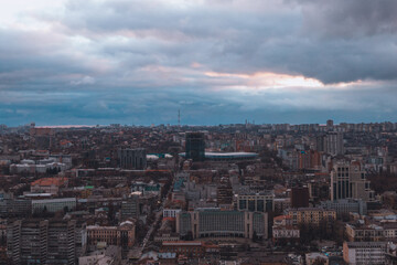 A bird's eye view of the dark blue sky over the city. Gloomy city
