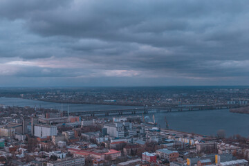 Fototapeta premium A bird's eye view of the dark blue sky over the city. Gloomy city