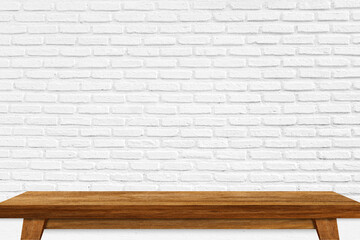 Wooden table with white brick wall. Use as montage for product display