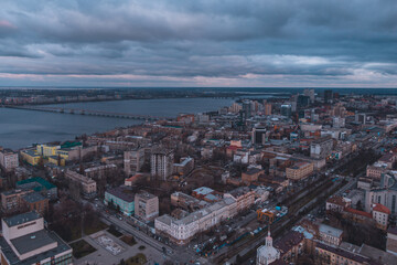 A bird's eye view of the dark blue sky over the city. Gloomy city