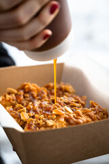 Fried chicken tenders drizzled with sauce
