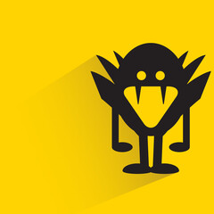cute monster with shadow on yellow background