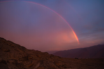 Fototapeta na wymiar rainbow over the mountains