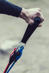 hand holding a pole working out