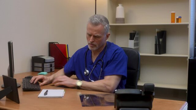defeated doctor gives up hope after examining chest x-ray as he realizes there is nothing he can do to help patient