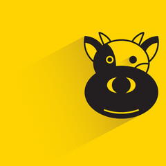 cow with shadow on yellow background