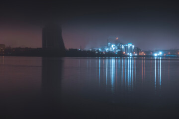 Obraz premium Beautiful panorama of the night city with water.