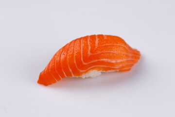 Appetizing fresh sushi with salmon on white background. Isolated. Sushi menu. Japanese food. Close-up.