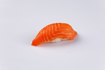 Appetizing fresh sushi with salmon on white background. Isolated. Sushi menu. Japanese food. Close-up.
