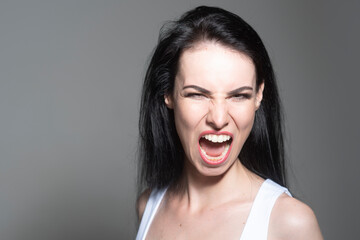 Screaming woman. Emotional portrait. Face expression. Human emotions. Shout. Isolated.