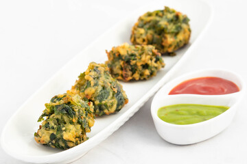 Healthy Tea Time Indian Chaat Snacks Palak Pakoda Bhajji Chat Or Paalak Pakora Bajji Bhajiya Made Of Chopped Spinach Dhaniya Pudina Leaves And Gram Dal Flour Besan Masala Daal Served With Red Chutney