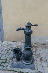Obraz premium Cast column for raising water from the ground. close-up 