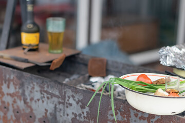 Dinner on the street, cooked over charcoal. Close-up