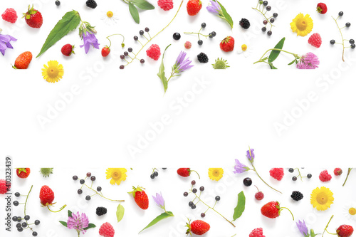 Frame from flowers and berries with place for text, top view. The concept of summer, spring, Mother's Day, March 8.