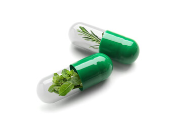 Spirulina capsules on white background