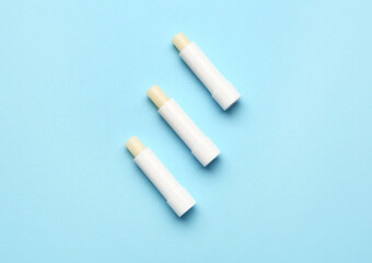 Natural lip balms on color background