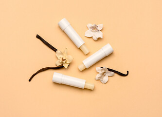 Natural lip balms with vanilla on color background