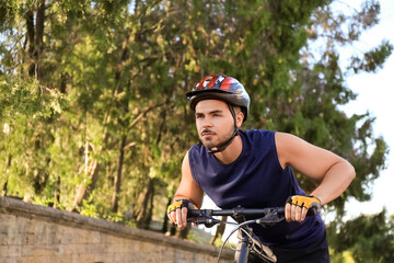 Male cyclist riding bicycle outdoors