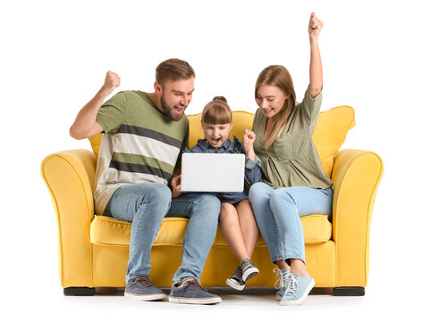 Happy family with laptop on sofa against white background