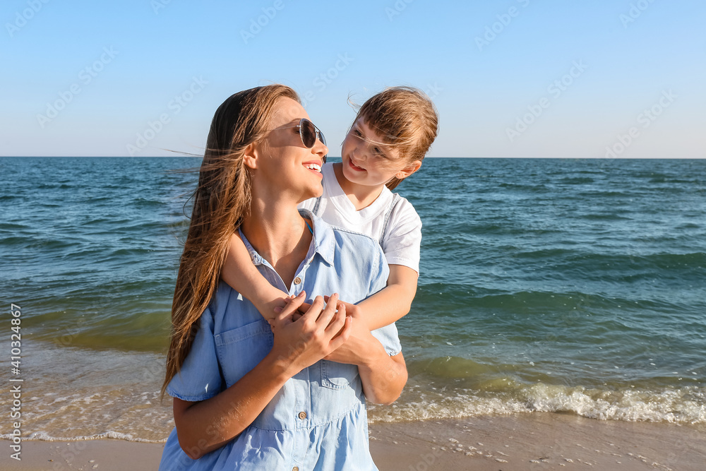 Wall mural Mother and daughter on sea beach