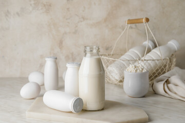 Different dairy products on light background