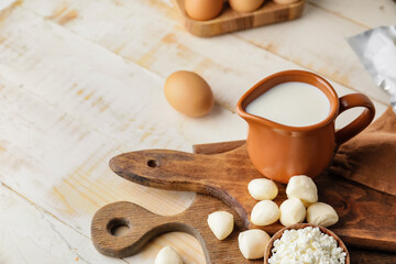 Different dairy products on wooden background