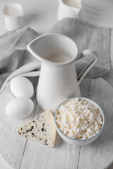 Different dairy products on light background