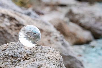 Crystal ball of fortune teller outdoors near river