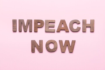 Text IMPEACH NOW on color background